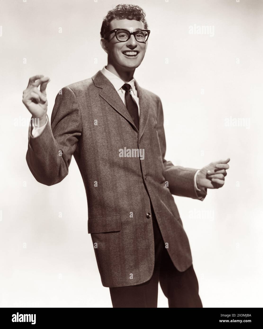 Buddy Holly, pioneer American rock and roll musician in 1957. Holly died at 22 in a tragic plane accident in 1959, along with musicians Richie Valens and J. P. Richardson (the Big Bopper), and pilot Roger Peterson. (USA) Stock Photo