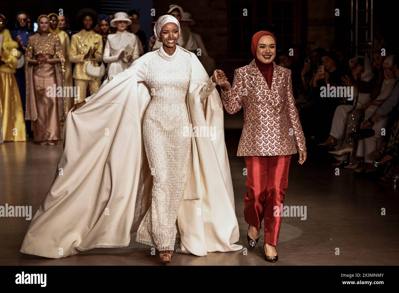 Istanbul, Turkey. 26th Apr, 2024. Model Halima Aden (L) seen with Linda Anggrea (R), CEO of Buttonscarves. On the second day of the Istanbul Modest Fashion Week 2024, the Australian brand Akkoia, the Egyptian MRGD and the Indonesian Buttonscarves presented their collections in the final exclusive fashion show of Istanbul Modest Fashion Week 2024 in Fisekhane Gallery, Istanbul. Credit: SOPA Images Limited/Alamy Live News Stock Photo