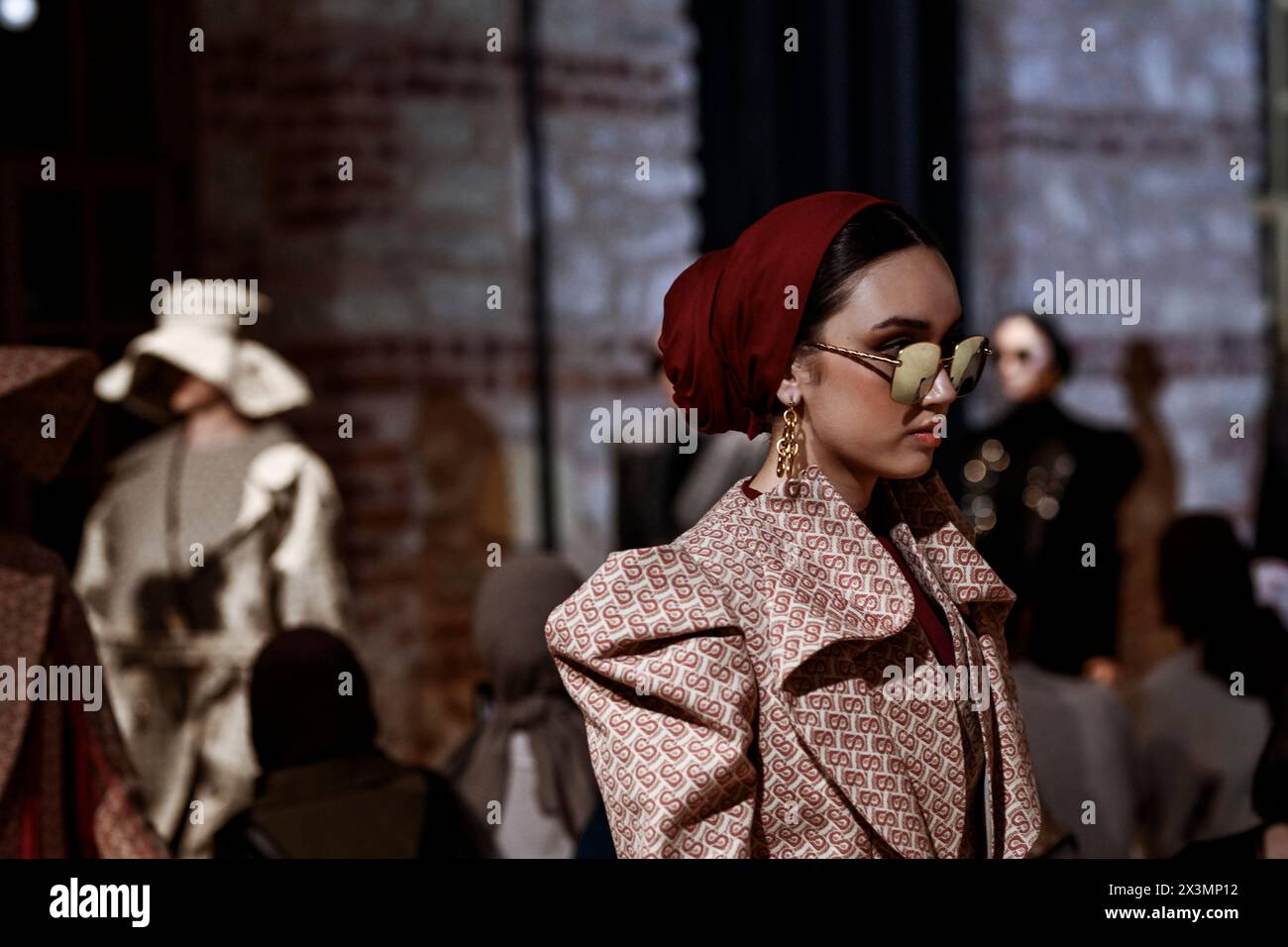 Istanbul, Turkey. 26th Apr, 2024. A model seen wearing sunglasses for Buttonscarves. On the second day of the Istanbul Modest Fashion Week 2024, the Australian brand Akkoia, the Egyptian MRGD and the Indonesian Buttonscarves presented their collections in the final exclusive fashion show of Istanbul Modest Fashion Week 2024 in Fisekhane Gallery, Istanbul. (Photo by Valeria Ferraro/SOPA Images/Sipa USA) Credit: Sipa USA/Alamy Live News Stock Photo