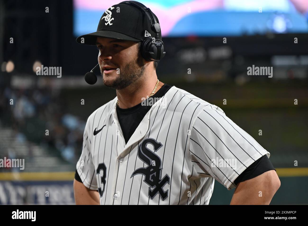 Chicago, United States. 27th Apr, 2024. Andrew Benintendi #23, professional baseball outfielder for the Chicago White Sox participates in a post-game interview after batting a two-run walk-off home run to win it for the Chicago White Sox in extra innings during the Major League Baseball game matchup between the Tampa Bay Rays and Chicago White Sox at Guaranteed Rate Field. For the first time all season, the Chicago White Sox have won two games in a row. Final score; Tampa Bay Rays 7 : 8 Chicago White Sox. Credit: SOPA Images Limited/Alamy Live News Stock Photo