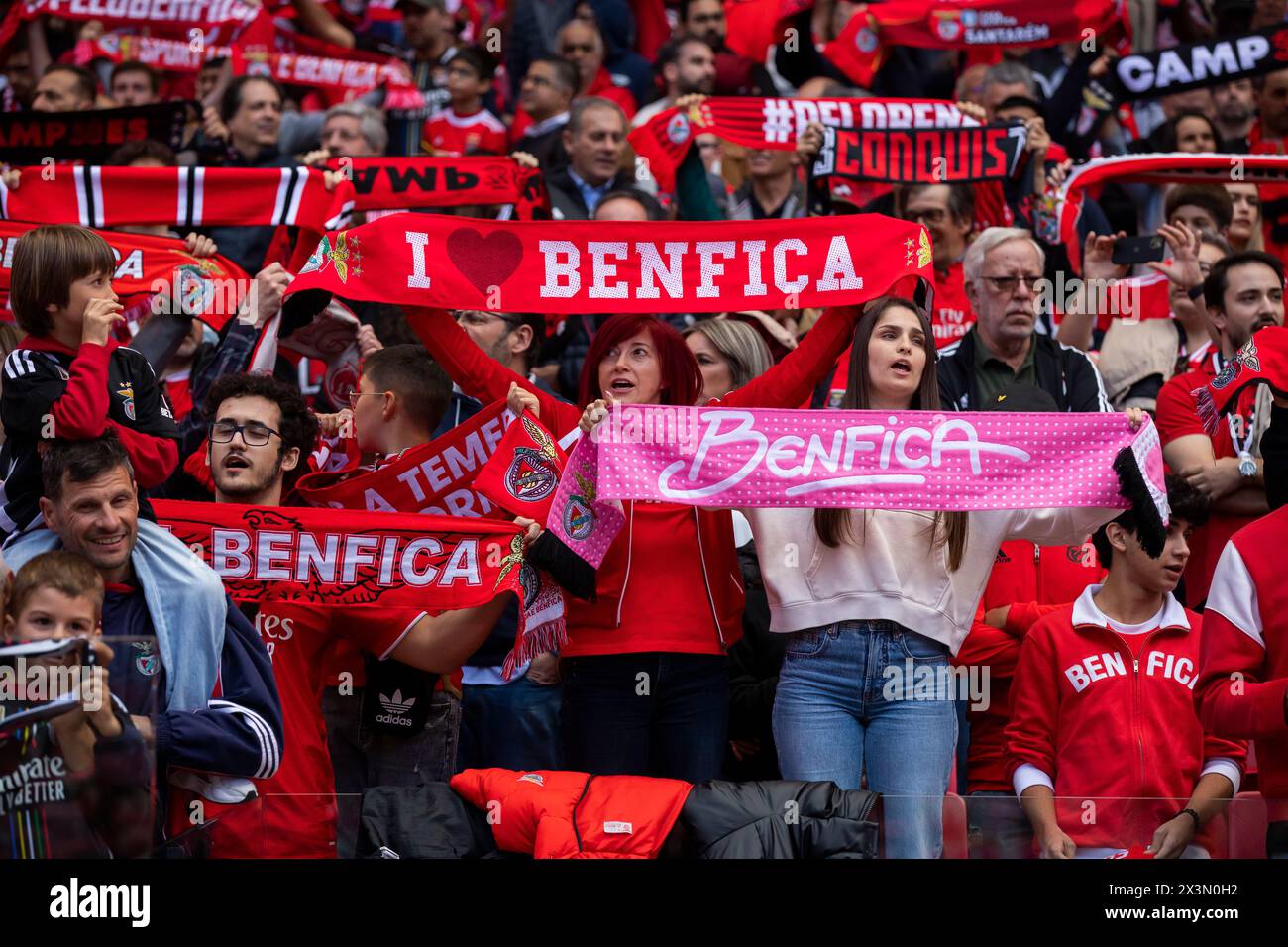 Lisbon, Portugal. 27th Apr, 2024. SL Benfica supporters hold scarves during the Liga Portugal Betclic football match between SL Benfica and SC Braga at Estadio da Luz Stadium. (Final score: SL Benfica 3 - 1 SC Braga) Credit: SOPA Images Limited/Alamy Live News Stock Photo