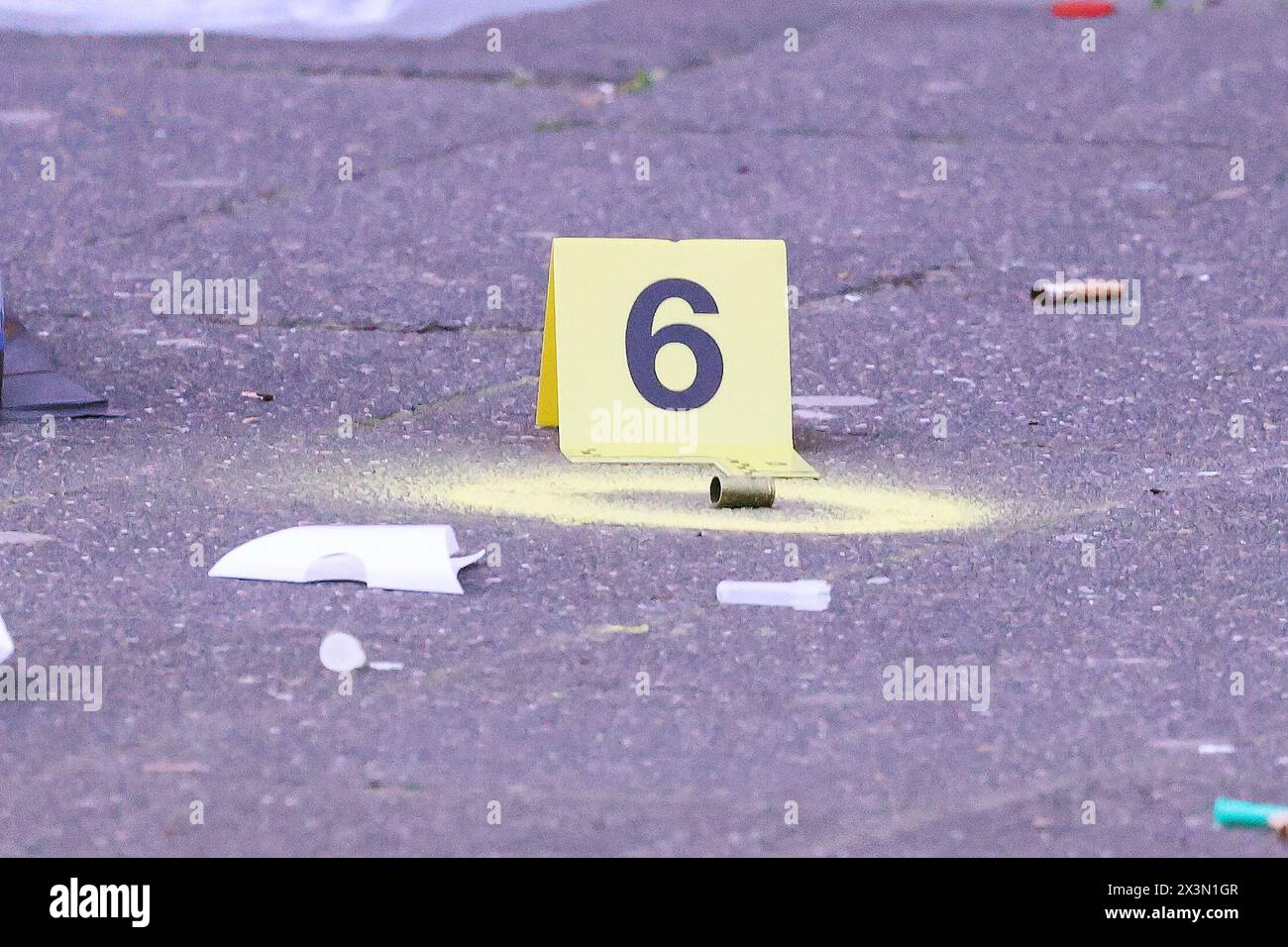 Duesseldorf, Germany. 28th Apr, 2024. An empty shell casing from a firearm lies on the sidewalk outside a pub in Düsseldorf. One person was killed by gunfire in Düsseldorf on Sunday morning. Credit: David Young/dpa/Alamy Live News Stock Photo