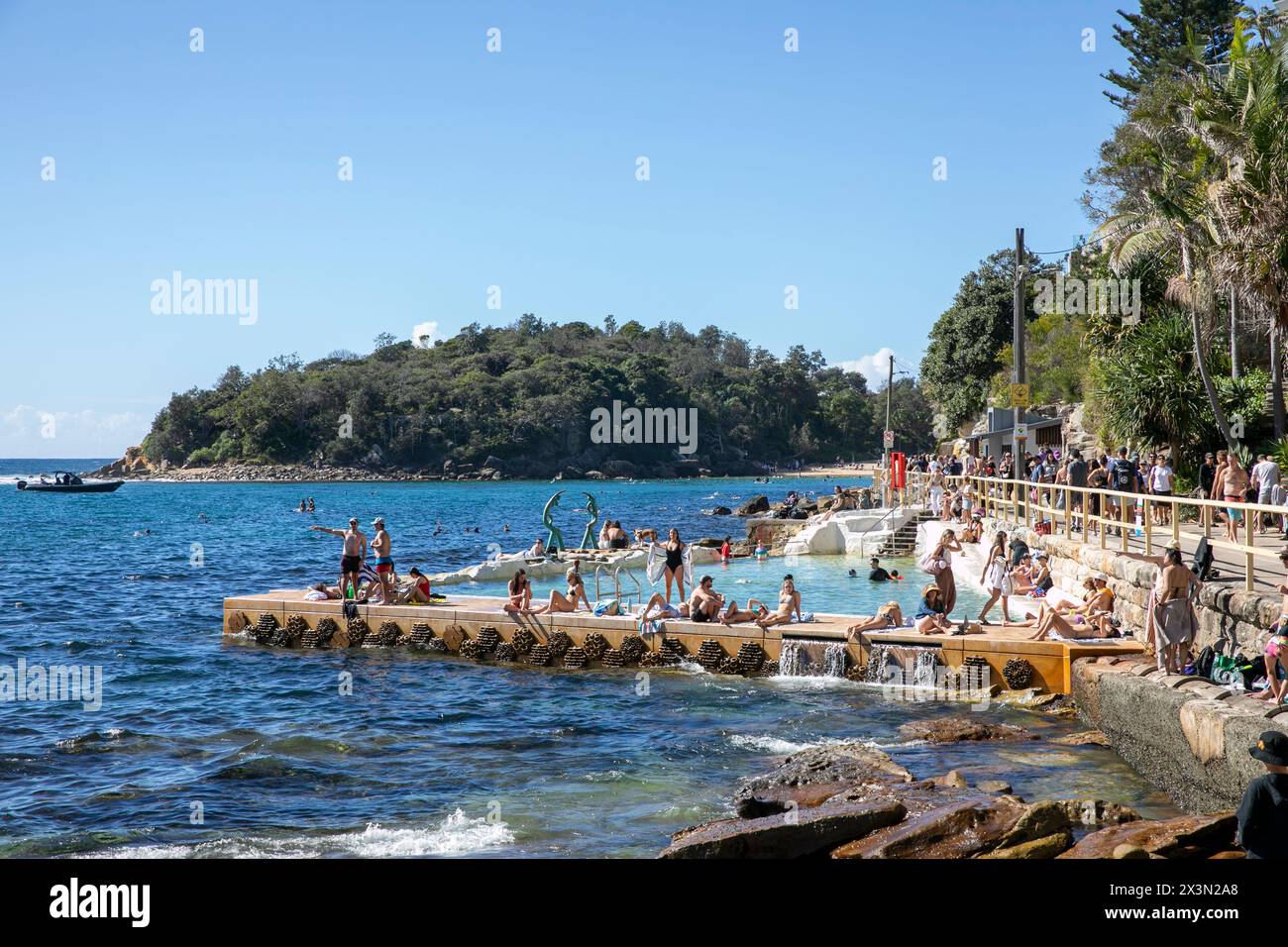 Fairy Bower ocean rockpool beside the scenic walkway between Manly Beach and Shelly beach,Sydney,NSW,Australia people swim on hot autumn day Stock Photo