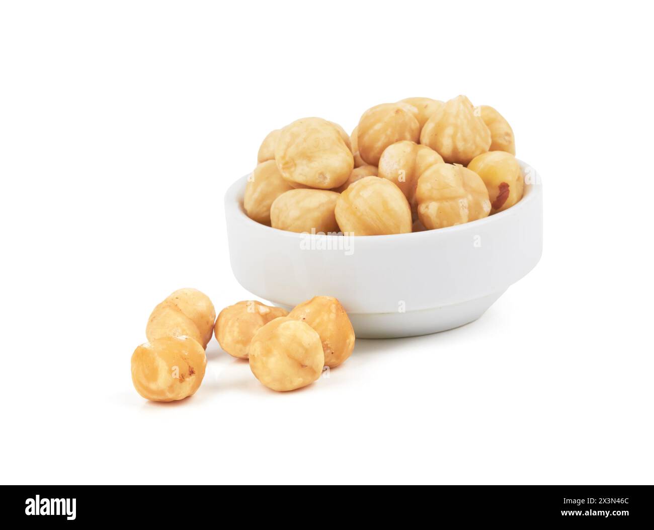 Hazelnuts in a bowl isolated on a white background Stock Photo