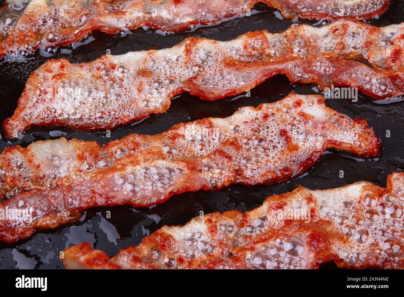 Fry bacon in pan slice hi-res stock photography and images - Alamy