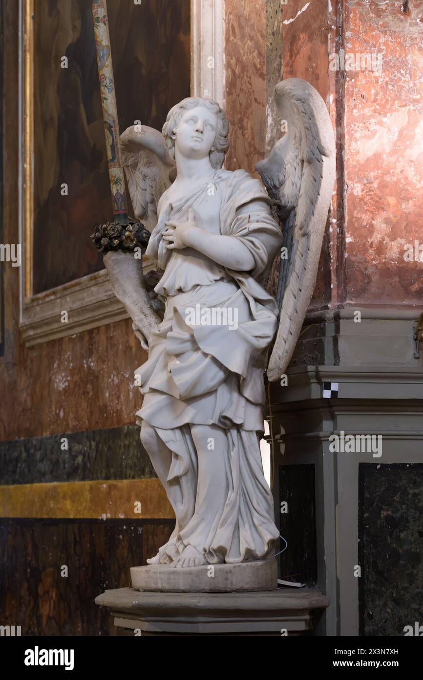 Sculpture of angel by workshop of Bernin in Santa Francesca Romana (Basilica di Santa Francesca Romana al Palatino) or Santa Maria Nova. Roman Forum. Stock Photo