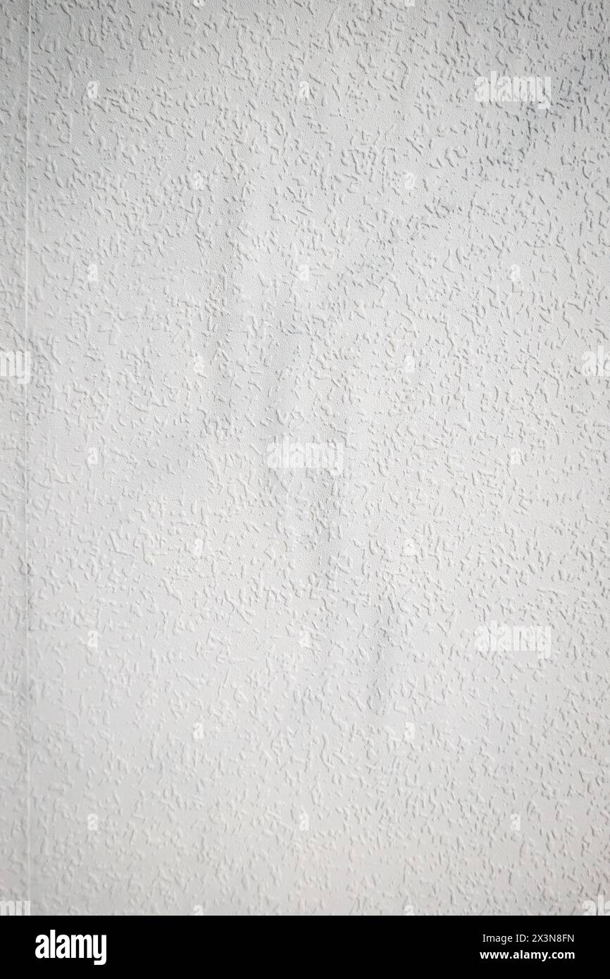 grey painted woodchip wallpaper texture pattern backgroung. Stock Photo