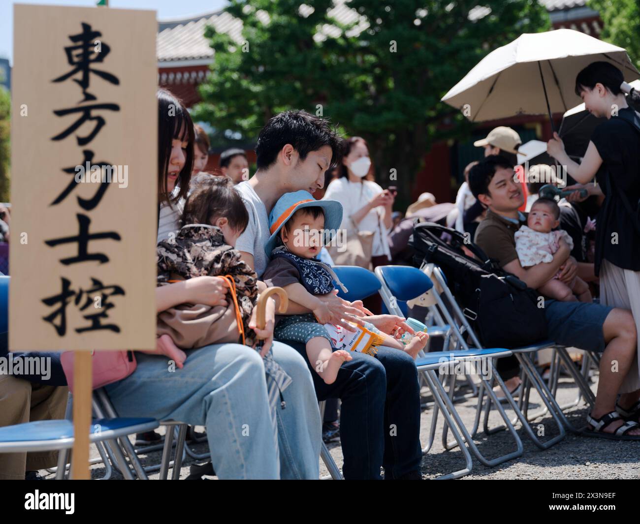 Tokyo, Japan. 28th Apr, 2024. Children wait for the competition of the Naki Sumo Crying Baby Contest in Tokyo, Japan, on April 28, 2024. Naki Sumo is a traditional ceremony performed as a prayer for healthy growth. Credit: Zhang Xiaoyu/Xinhua/Alamy Live News Stock Photo