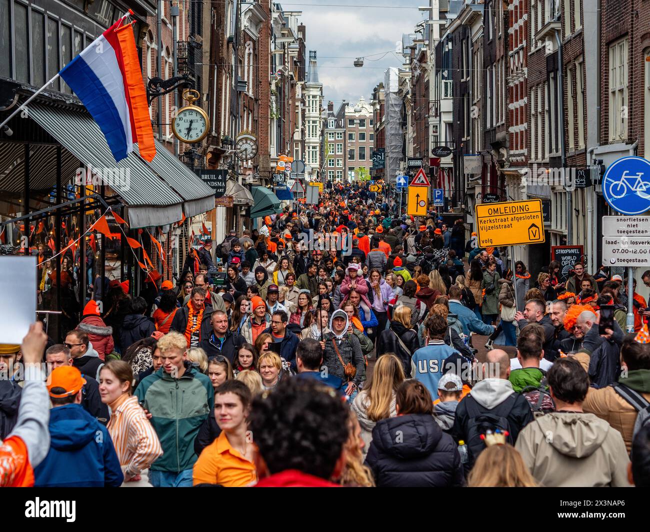 Amsterdam, Netherlands. 27th Apr, 2024. Streets are seen full of people enjoying the celebration. King's Day is renowned for being one of the biggest and most colorful festivities in the country, especially in Amsterdam. The city is bursting with orange as people enjoy the biggest street party of the year, enjoying the free markets and having fun on the boats along the canals. Credit: SOPA Images Limited/Alamy Live News Stock Photo