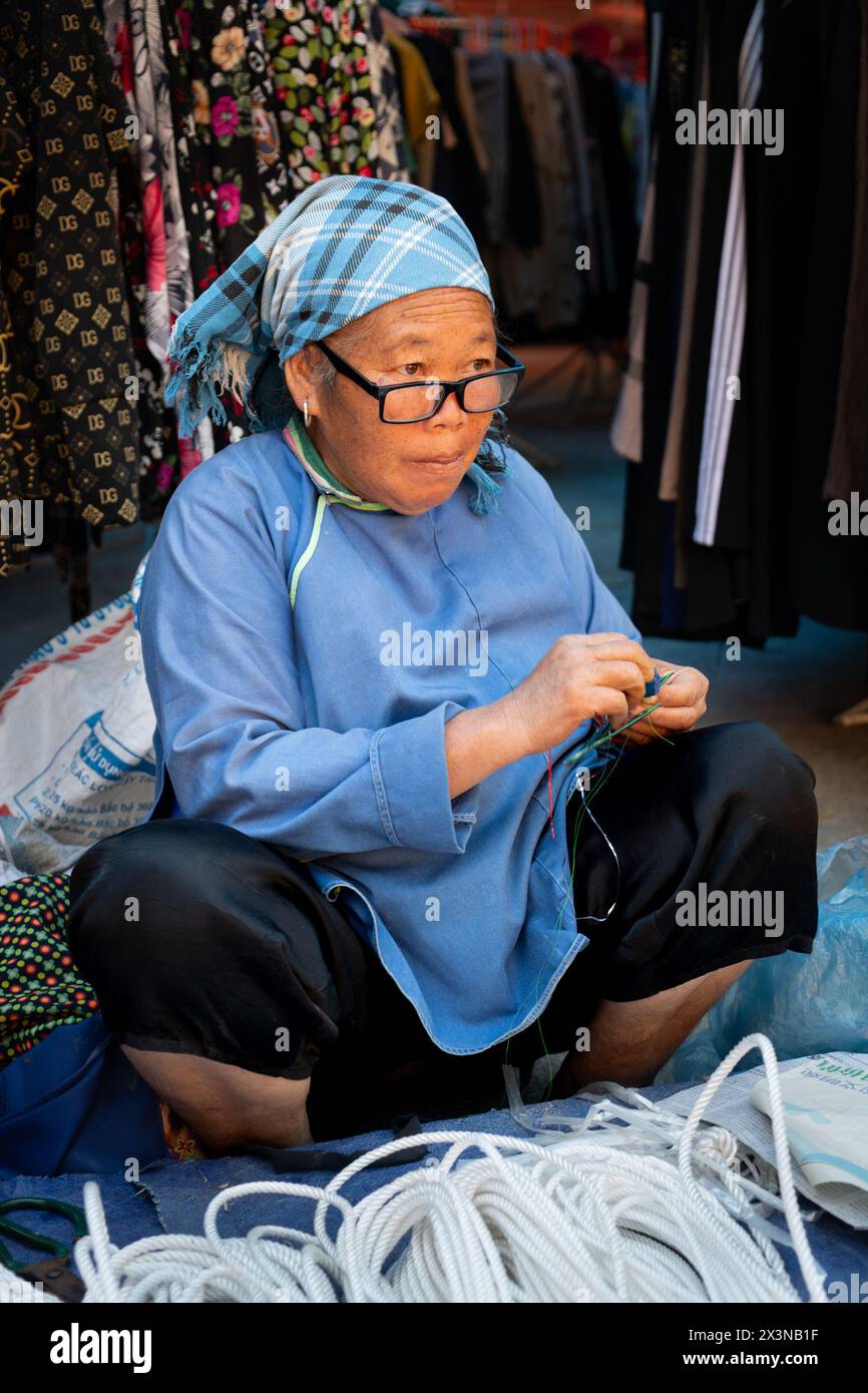 Flower Hmong woman at the Can Cau Market in Lao Cai Province, Vietnam Stock Photo