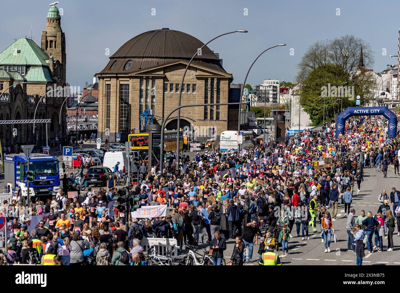 Hamburg, Germany. 28th Apr, 2024. Athletics: Marathon. Countless spectators line the course of the Hamburg Marathon at the old Elbe tunnel in the harbor. Credit: Axel Heimken/dpa/Alamy Live News Stock Photo