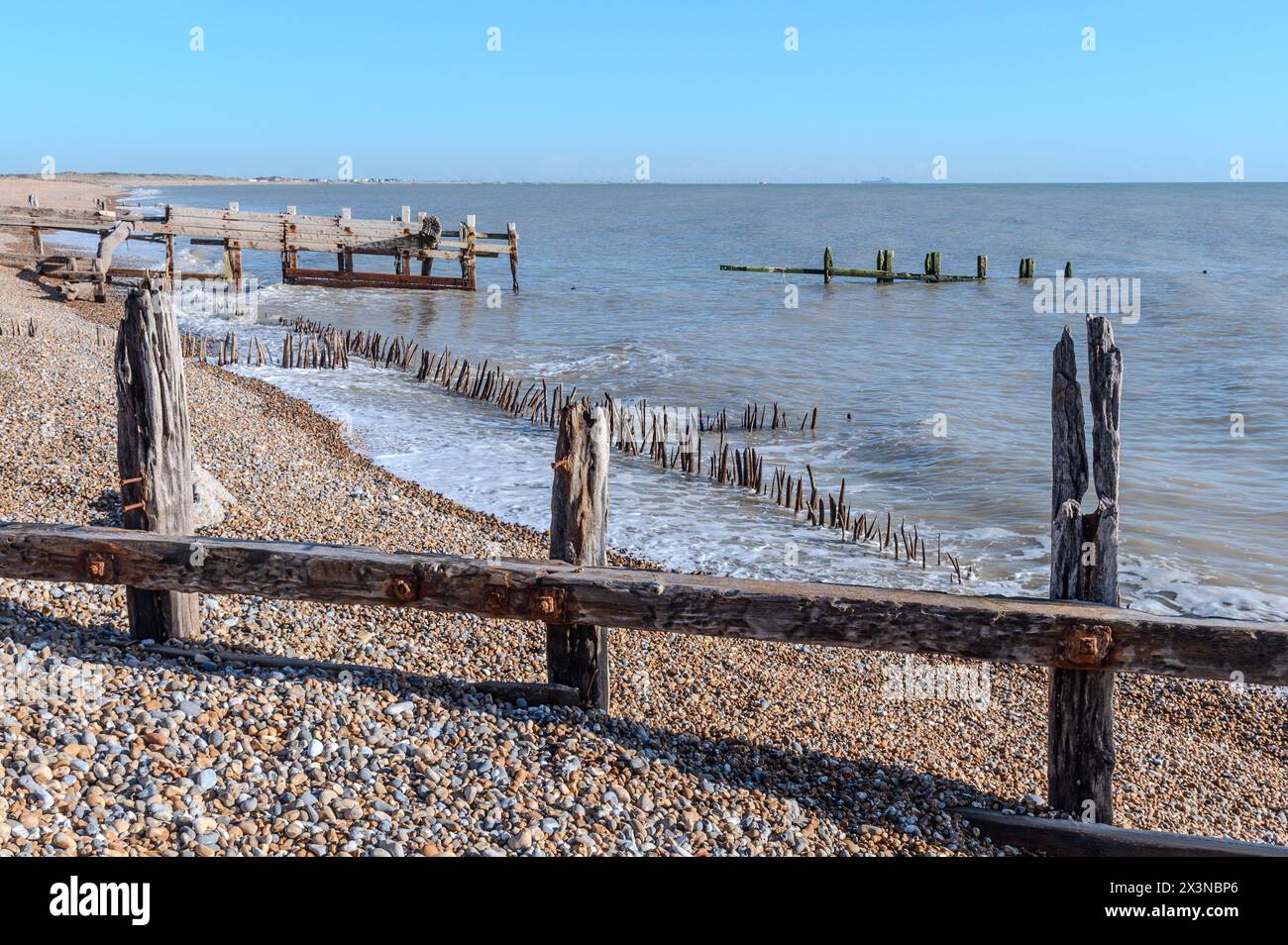 Old wooden sea defences at Rye Harbour Nature Reserve, East Sussex, England Stock Photo