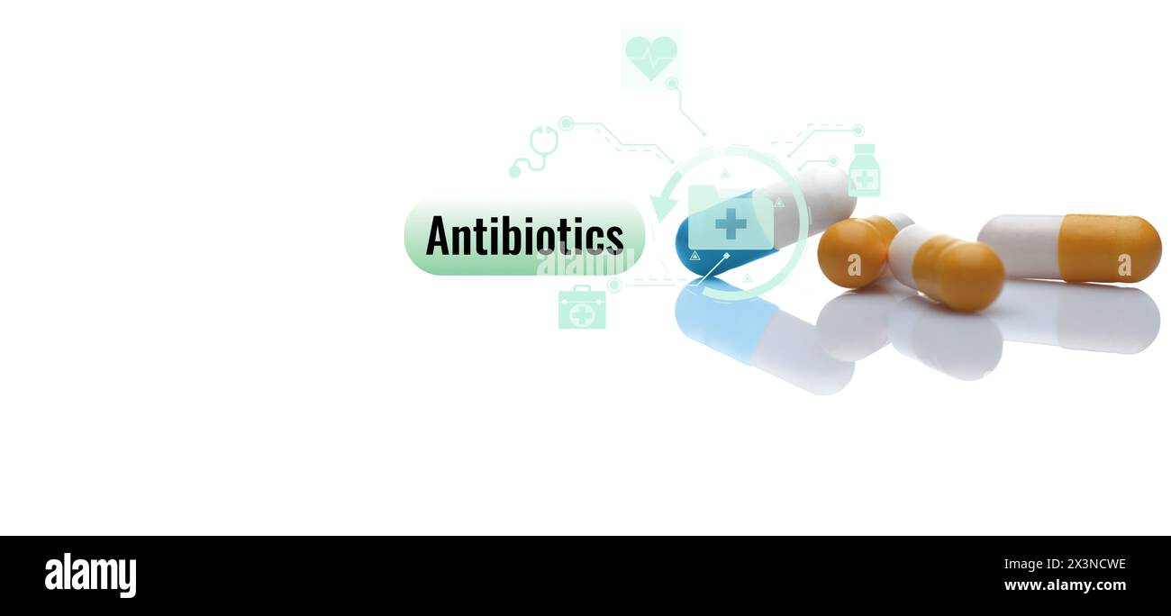 Antibiotic capsule pills on white background. Prescription drugs. Colorful capsule pills. Antibiotic drug. Pharmaceutical industry. Hospital care Stock Photo
