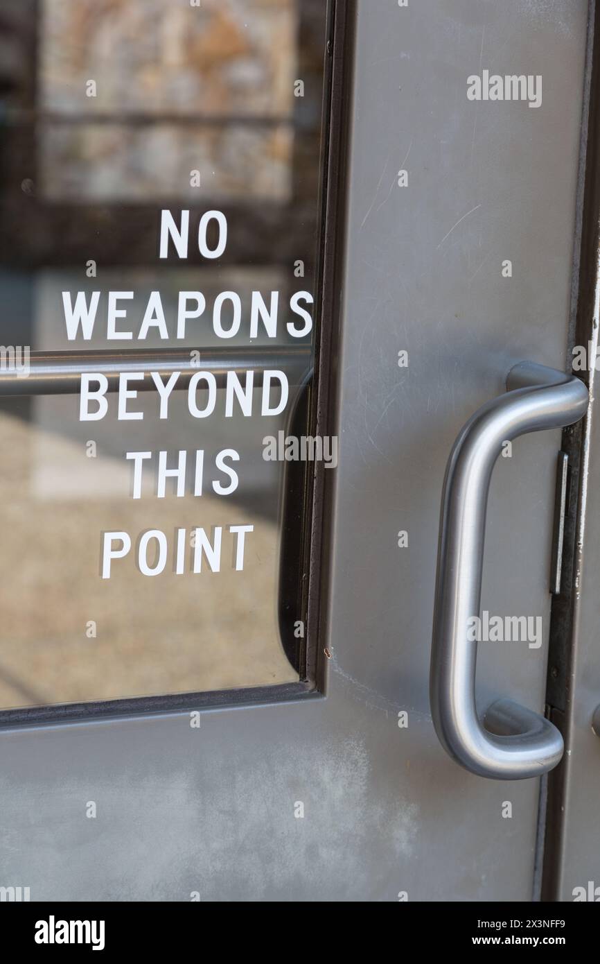 Gun Control.  'No Weapons Beyond this Point.'  Entrance to Roadside Rest Stop on U.S. Interstate 59, Alabama, USA, 2014. Stock Photo