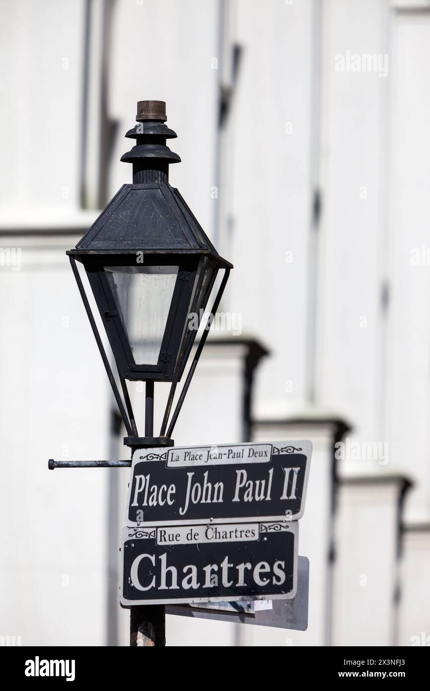 French Quarter, New Orleans, Louisiana.  Street Signs and Lamp by St. Louis Cathedral, Chartres Street, Marking Place John Paul II. Stock Photo