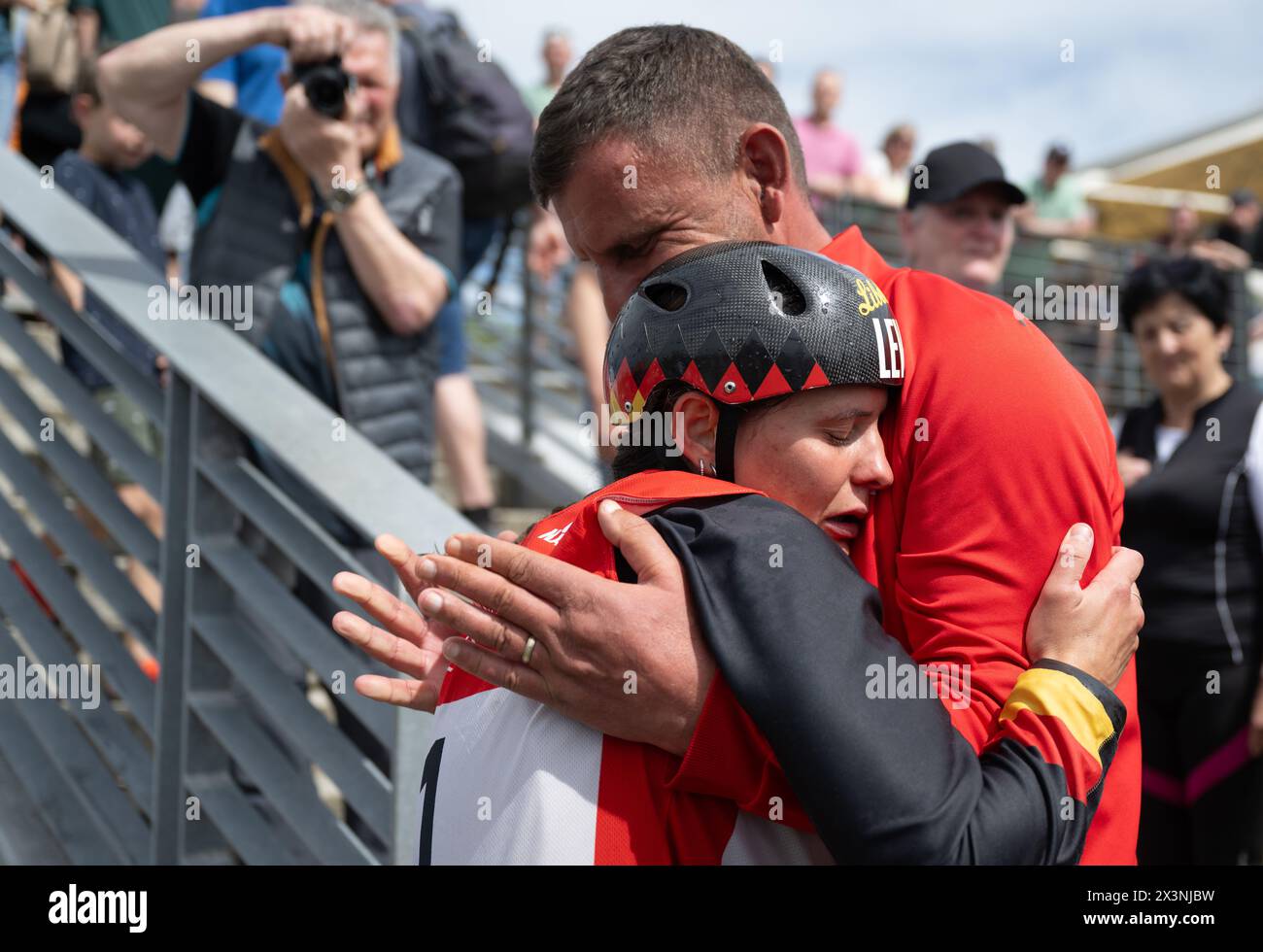 Markkleeberg, Germany. 28th Apr, 2024. Canoeing: German Olympic qualification canoe slalom, women's canoe, final. Elena Lilik is delighted with her Olympic ticket together with her father and national canoe slalom coach Thomas Apel. Credit: Hendrik Schmidt/dpa/Alamy Live News Stock Photo