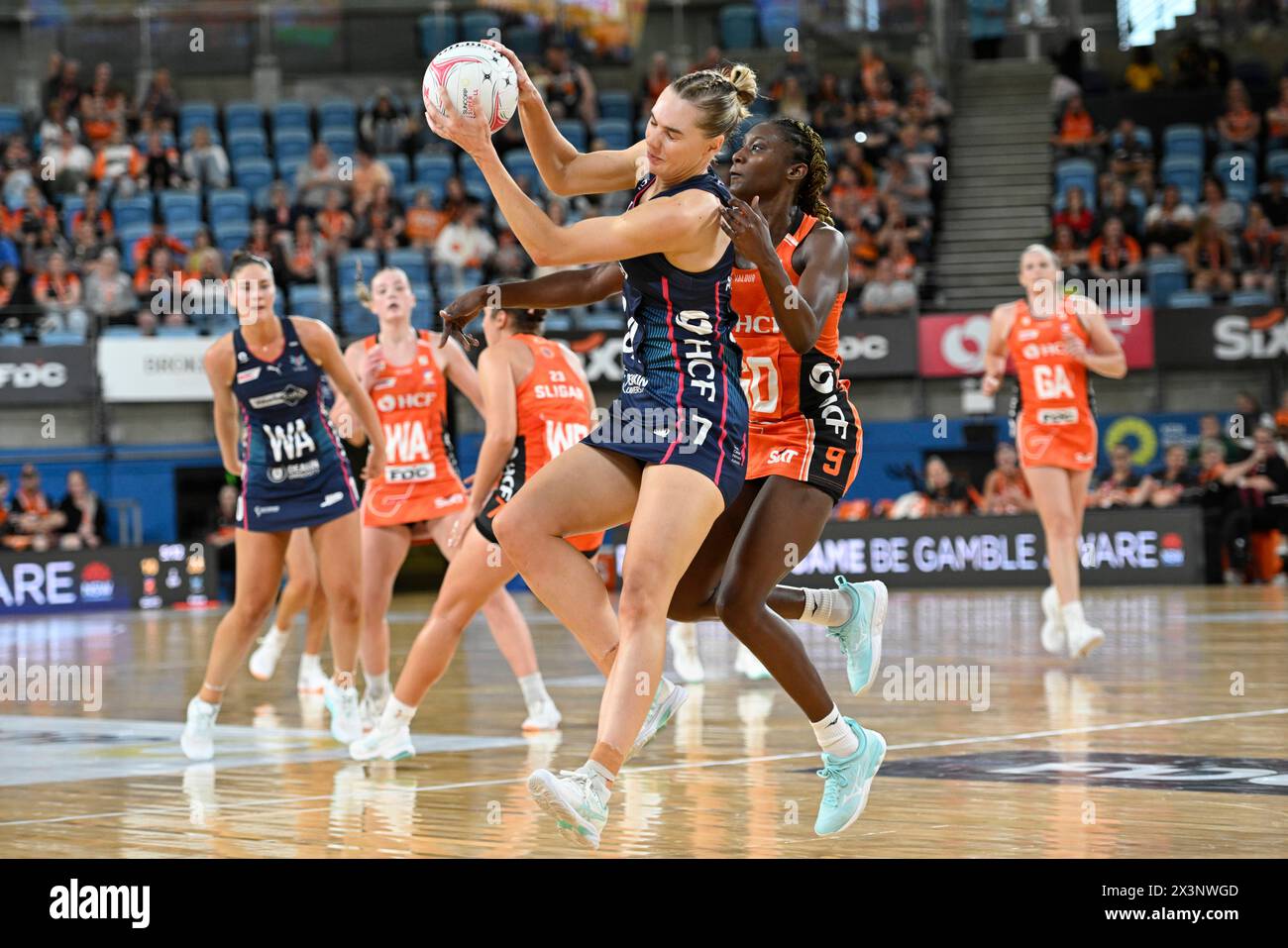 28th April 2024; Ken Rosewall Arena, Sydney, NSW, Australia: Suncorp Super Netball, Giants Netball versus Melbourne Vixens; Kiera Austin of the Melbourne Vixens catches the ball under pressure from Jodi-Ann Ward of the Giants Stock Photo