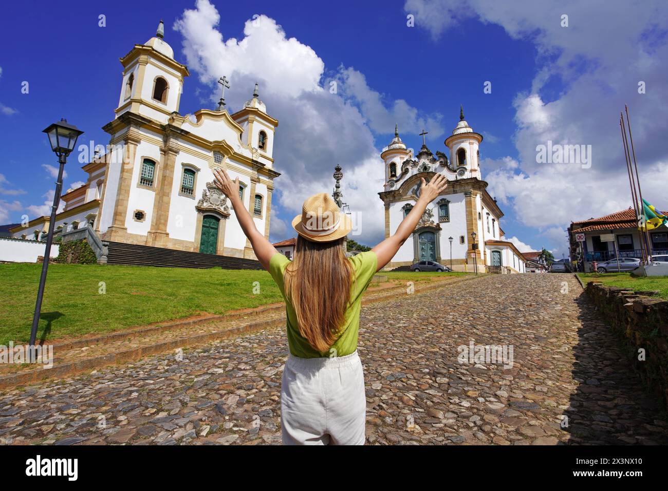 Tourism in Minas Gerais, Brazil. Traveler girl visiting historical town of Mariana with baroque colonial architecture, Brazil. Stock Photo