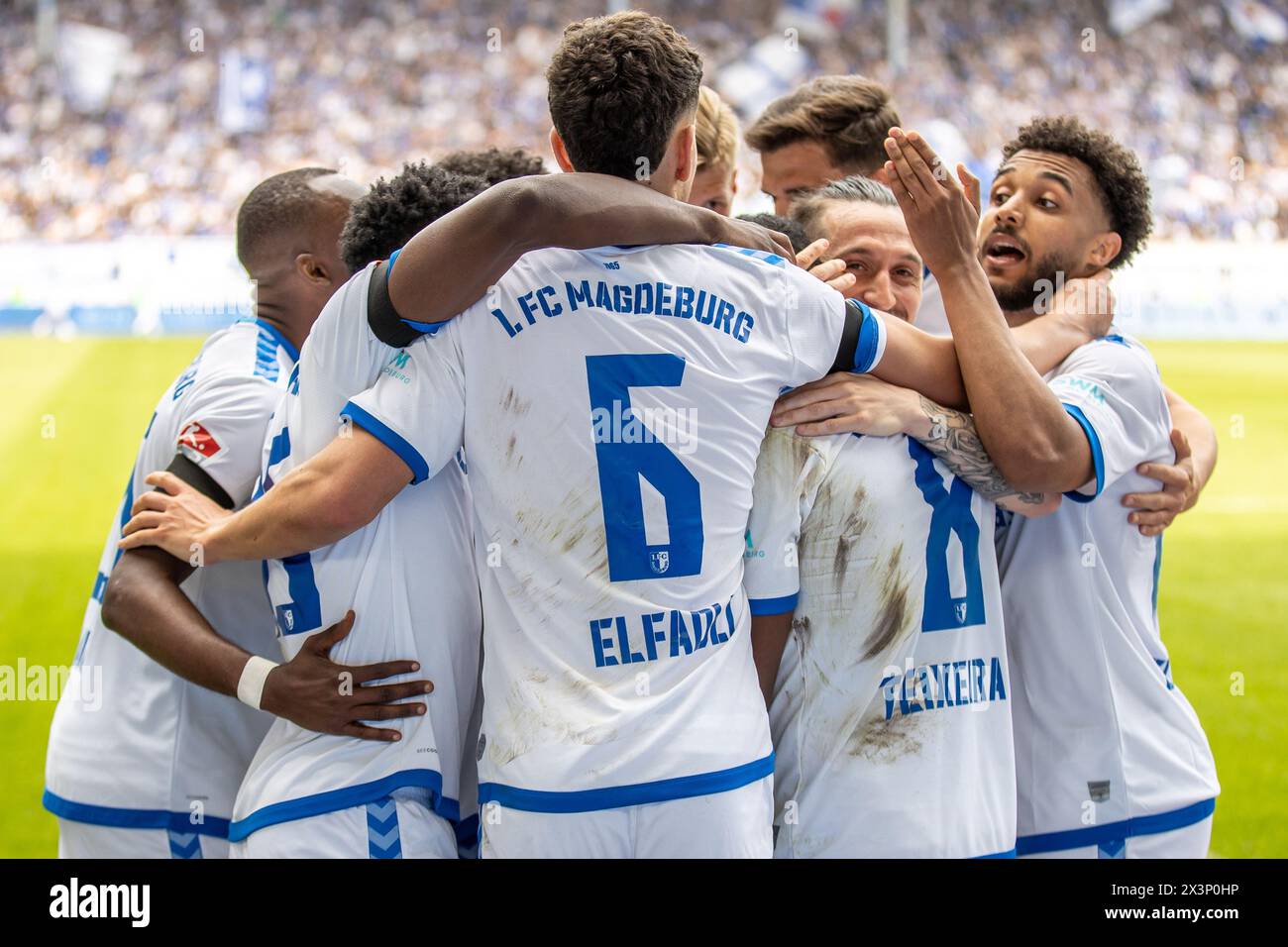 Magdeburg, Germany. 28th Apr, 2024. Soccer: Bundesliga 2, 1. FC Magdeburg - VfL Osnabrück, Matchday 31, MDCC-Arena. Magdeburg's players celebrate after the 1:0 goal. Credit: Andreas Gora/dpa - IMPORTANT NOTE: In accordance with the regulations of the DFL German Football League and the DFB German Football Association, it is prohibited to utilize or have utilized photographs taken in the stadium and/or of the match in the form of sequential images and/or video-like photo series./dpa/Alamy Live News Stock Photo