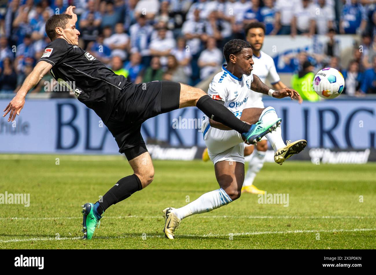 Magdeburg, Germany. 28th Apr, 2024. Soccer: Bundesliga 2, 1. FC Magdeburg - VfL Osnabrück, matchday 31, MDCC-Arena. Osnabrück's Maximilian Thalhammer (l) fights for the ball against 1. FC Magdeburg's Bryan Teixeira. Credit: Andreas Gora/dpa - IMPORTANT NOTE: In accordance with the regulations of the DFL German Football League and the DFB German Football Association, it is prohibited to utilize or have utilized photographs taken in the stadium and/or of the match in the form of sequential images and/or video-like photo series./dpa/Alamy Live News Stock Photo