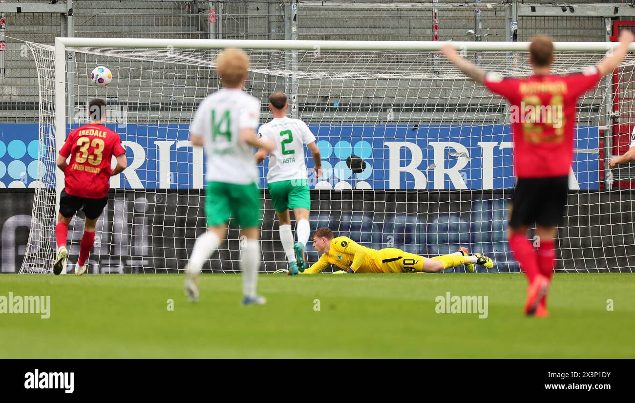 Wiesbaden, Germany. 28th Apr, 2024. Soccer: Bundesliga 2, SV Wehen Wiesbaden - SpVgg Greuther Fürth, Matchday 31, BRITA Arena. Fürth goalkeeper Jonas Urbig (below) concedes Wiesbaden's goal to make it 1-0. Credit: Jörg Halisch/dpa - IMPORTANT NOTE: In accordance with the regulations of the DFL German Football League and the DFB German Football Association, it is prohibited to utilize or have utilized photographs taken in the stadium and/or of the match in the form of sequential images and/or video-like photo series./dpa/Alamy Live News Stock Photo