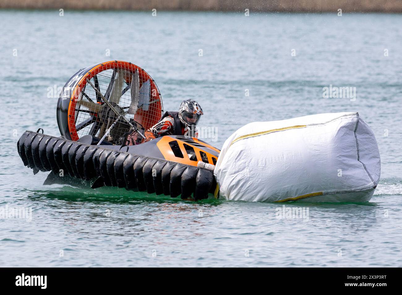 28 April 2024, Saxony, Weißwasser: Magnus Ivanoff from Sweden drives his hovercraft on the race track at the European Hovercraft Championships on Lake Halbendorf near Weißwasser. The drivers race across the water at more than 140 km/h. Photo: Daniel Schäfer/dpa Stock Photo