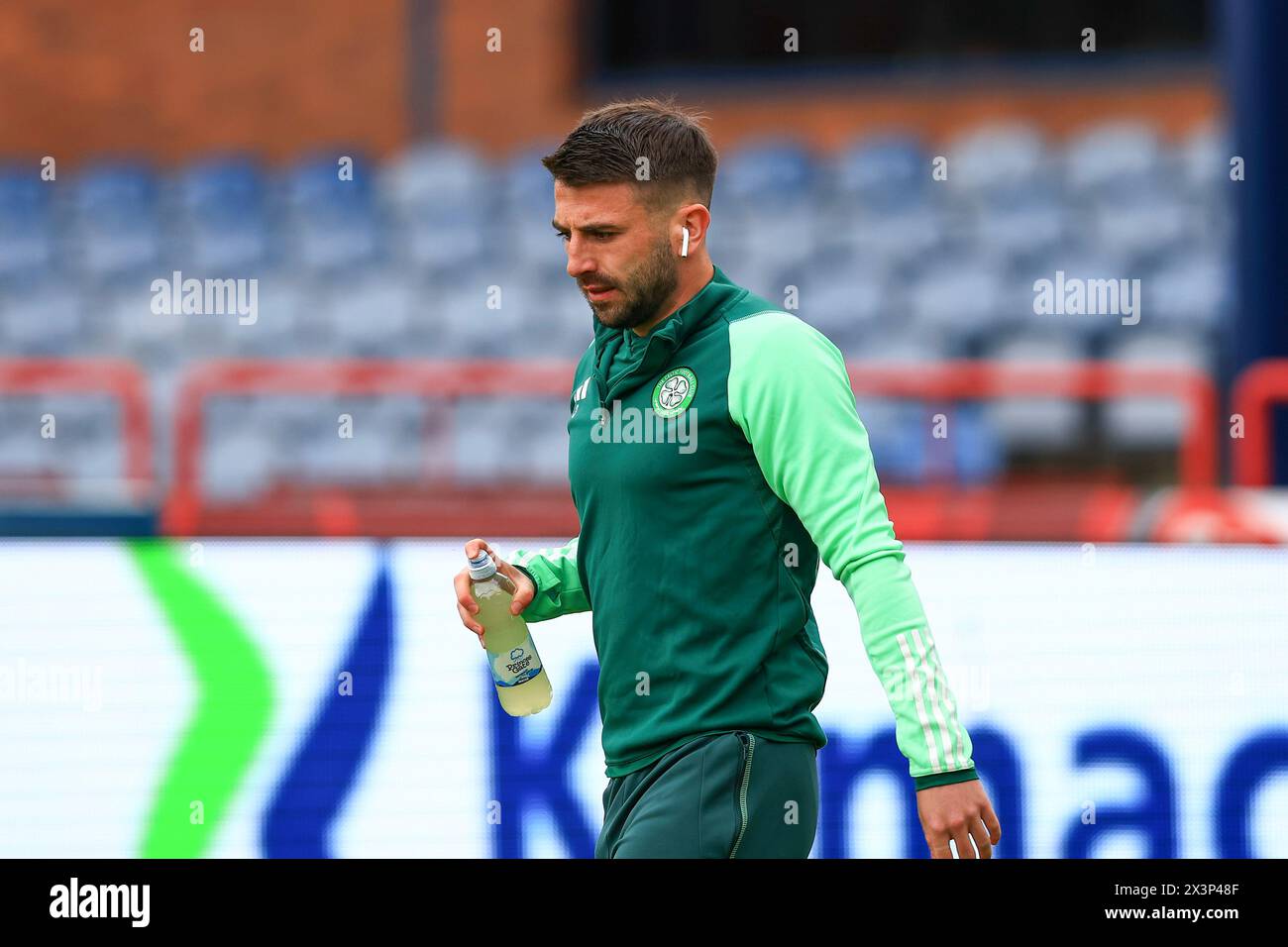 Dens Park, Dundee, UK. 28th Apr, 2024. Scottish Premiership Football, Dundee versus Celtic; Greg Taylor of Celtic inspects the pitch before the match Credit: Action Plus Sports/Alamy Live News Stock Photo