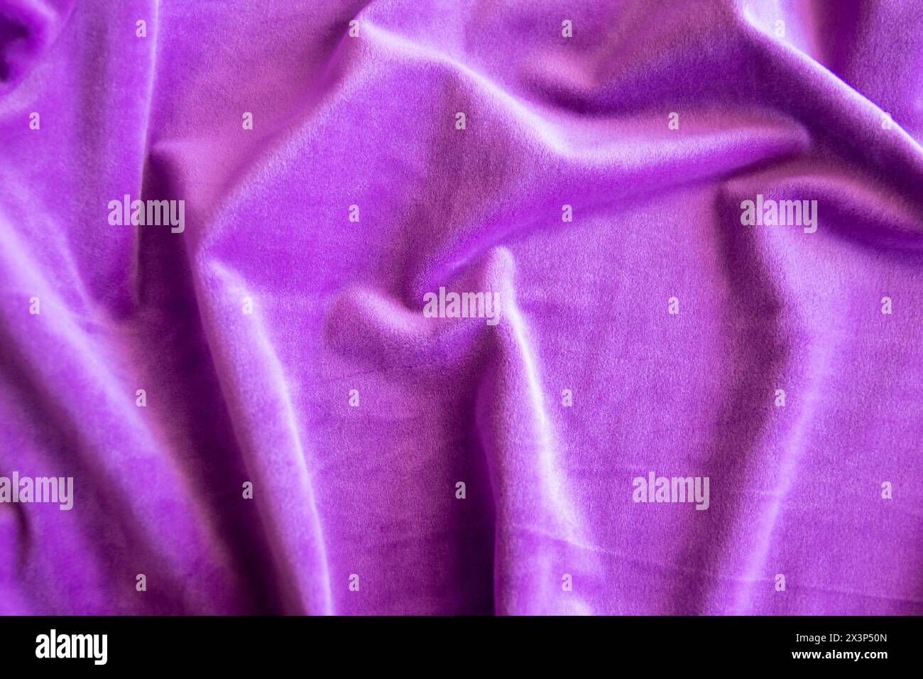 Lilac knitted texture fabric. Purple textile cloth background. Soft material for fashion clothes. Stock Photo