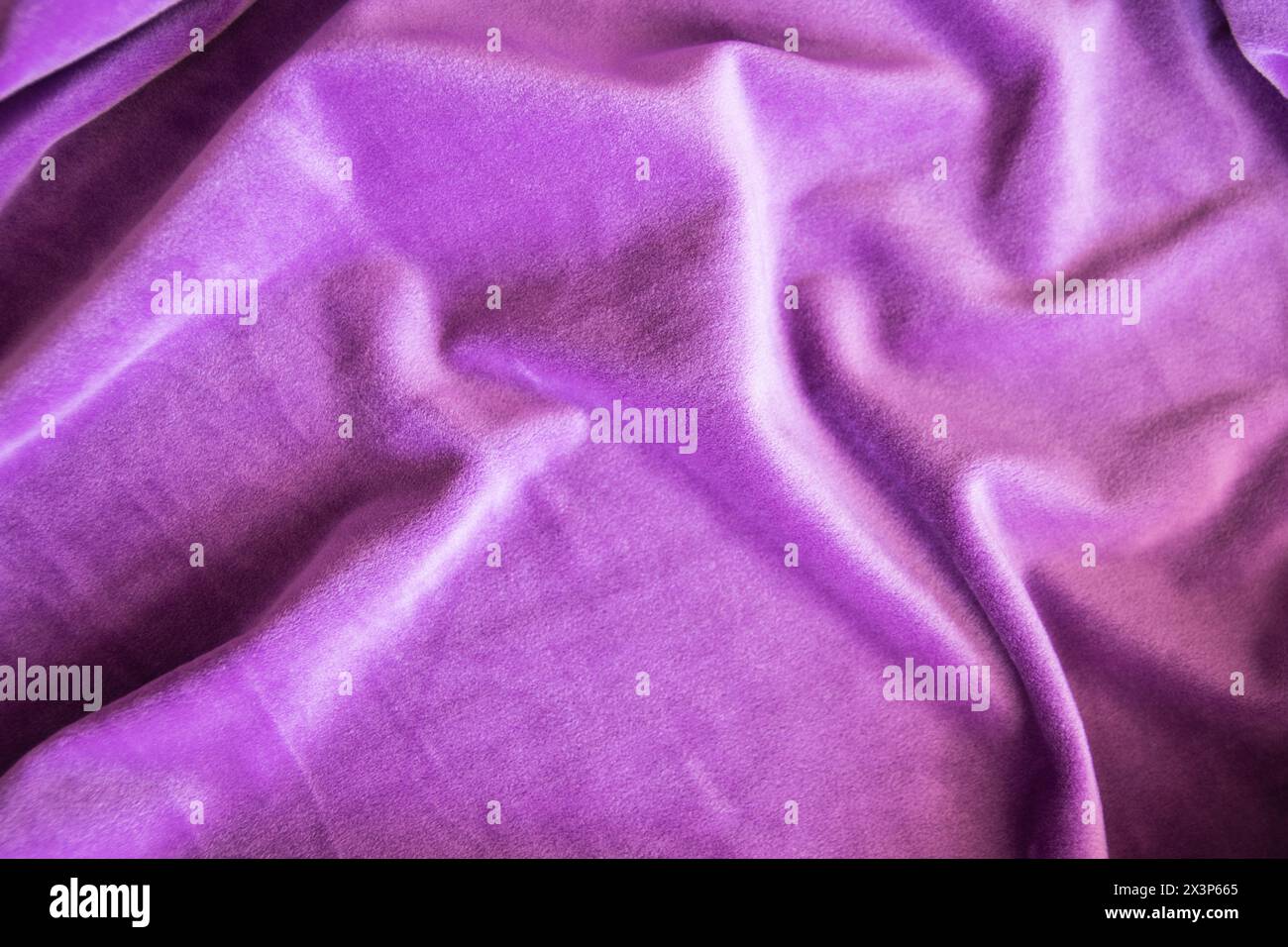 Lilac knitted texture fabric. Purple textile cloth background. Soft material for fashion clothes. Stock Photo