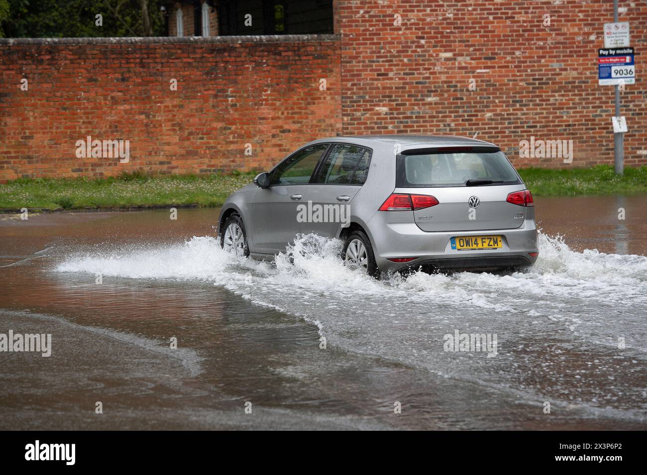 Chalfont St Giles, Buckinghamshire, UK. 28th April, 2024. A flooded car park. Parts of the village of Chalfont St Giles in Buckinghamshire was flooded again today after heavy overnight rain. There are ongoing issues with groundwater flooding across the Chalfonts. Credit: Maureen McLean/Alamy Live News Stock Photo