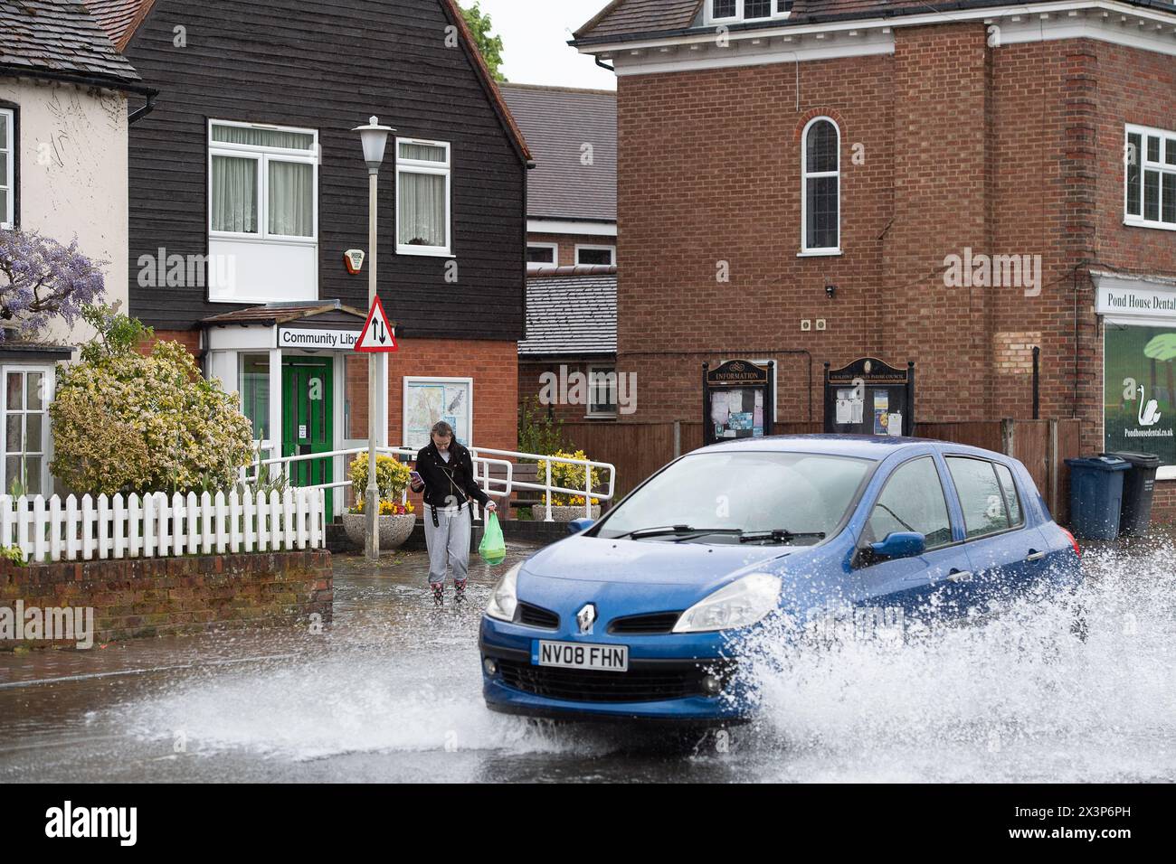Chalfont St Giles, Buckinghamshire, UK. 28th April, 2024. Motorists driving through floodwater. Parts of the village of Chalfont St Giles in Buckinghamshire was flooded again today after heavy overnight rain. There are ongoing issues with groundwater flooding across the Chalfonts. Credit: Maureen McLean/Alamy Live News Stock Photo
