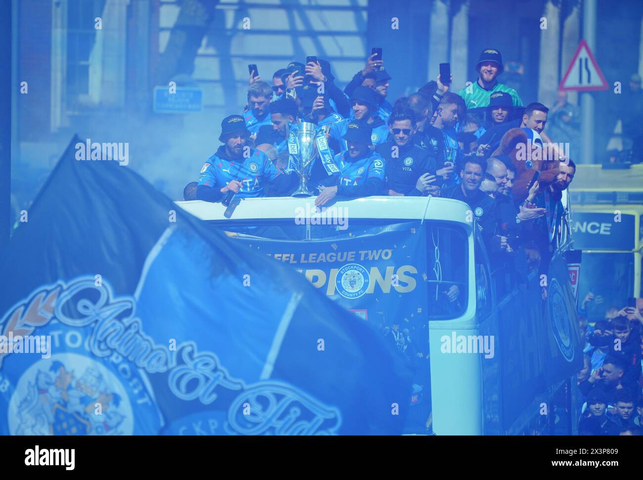 Stockport County Players celebrate during an opentop bus parade in