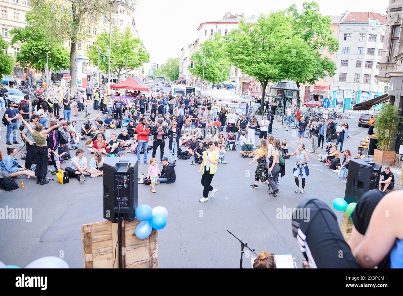 Berlin, Germany. 28th Apr, 2024. Members of various alliances such as 'Tesla den Hahn abdrehen', 'A100 stoppen!' or 'Görlitz zaunfrei!' celebrate a street party in Kreuzberg to demonstrate against Tesla and car policy. Credit: Annette Riedl/dpa/Alamy Live News Stock Photo