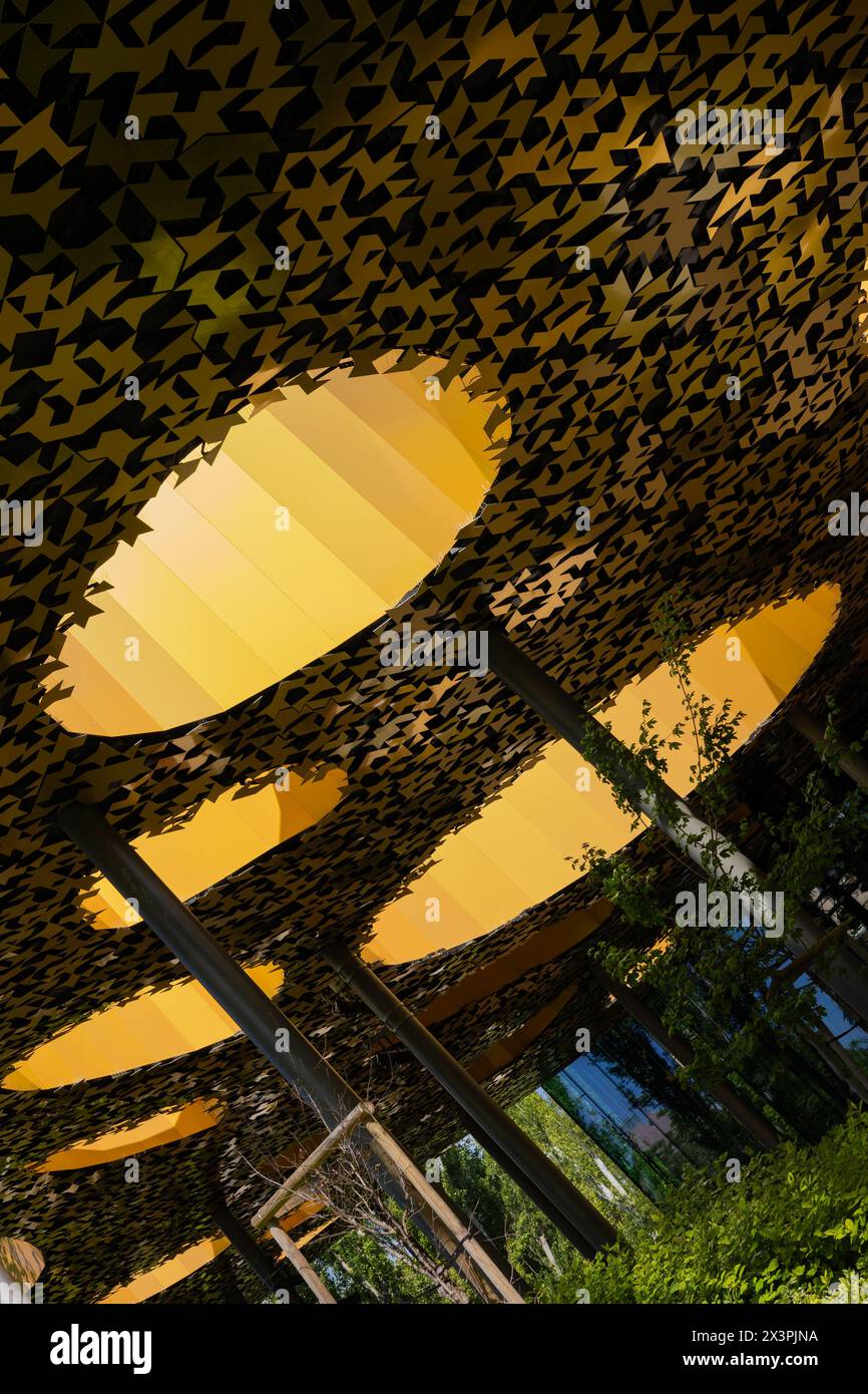 The roof of the Hungarian Music House from the inside. The sun shines through the roof, illuminating the intriguing, golden-colored mosaics. Stock Photo