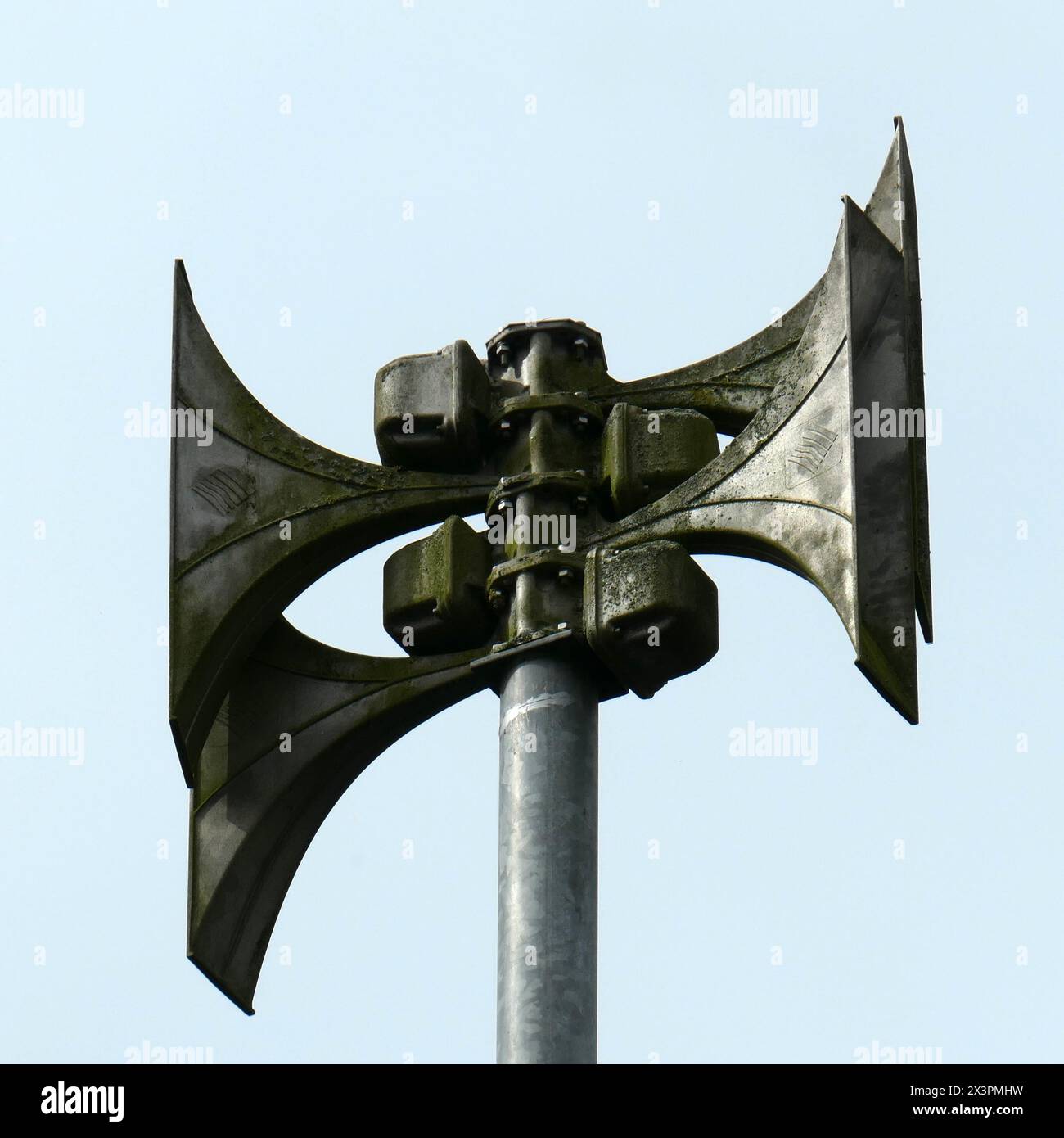 An old-fashioned but still functioning civil defense siren in a small German village, which must warn citizens of impending danger. In Germany these a Stock Photo