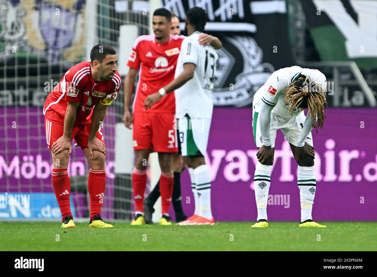 28 April 2024, North Rhine-Westphalia, Mönchengladbach: Soccer: Bundesliga, Borussia Mönchengladbach - 1. FC Union Berlin, matchday 31, Borussia-Park stadium. Mönchengladbach's Manu Kone (r) and Berlin's Rani Khedira (l) after the match. Photo: Federico Gambarini/dpa - IMPORTANT NOTE: In accordance with the regulations of the DFL German Football League and the DFB German Football Association, it is prohibited to utilize or have utilized photographs taken in the stadium and/or of the match in the form of sequential images and/or video-like photo series. Stock Photo