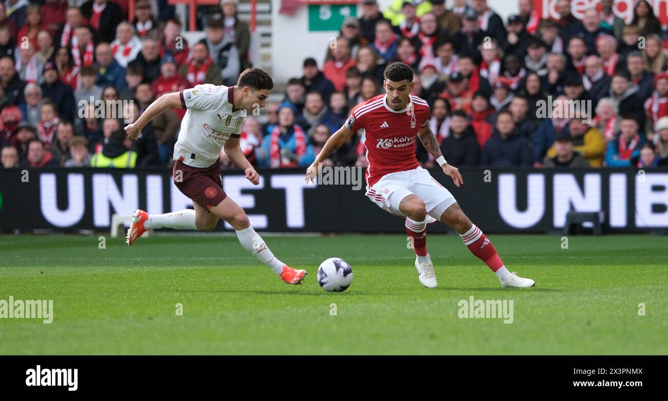 The City Ground, Nottingham, UK. 28th Apr, 2024. Premier League Football, Nottingham Forest versus Manchester City; Julian Alvarez of Manchester City challenges for the ball against Morgan Gibbs-White of Nottingham Forest Credit: Action Plus Sports/Alamy Live News Stock Photo