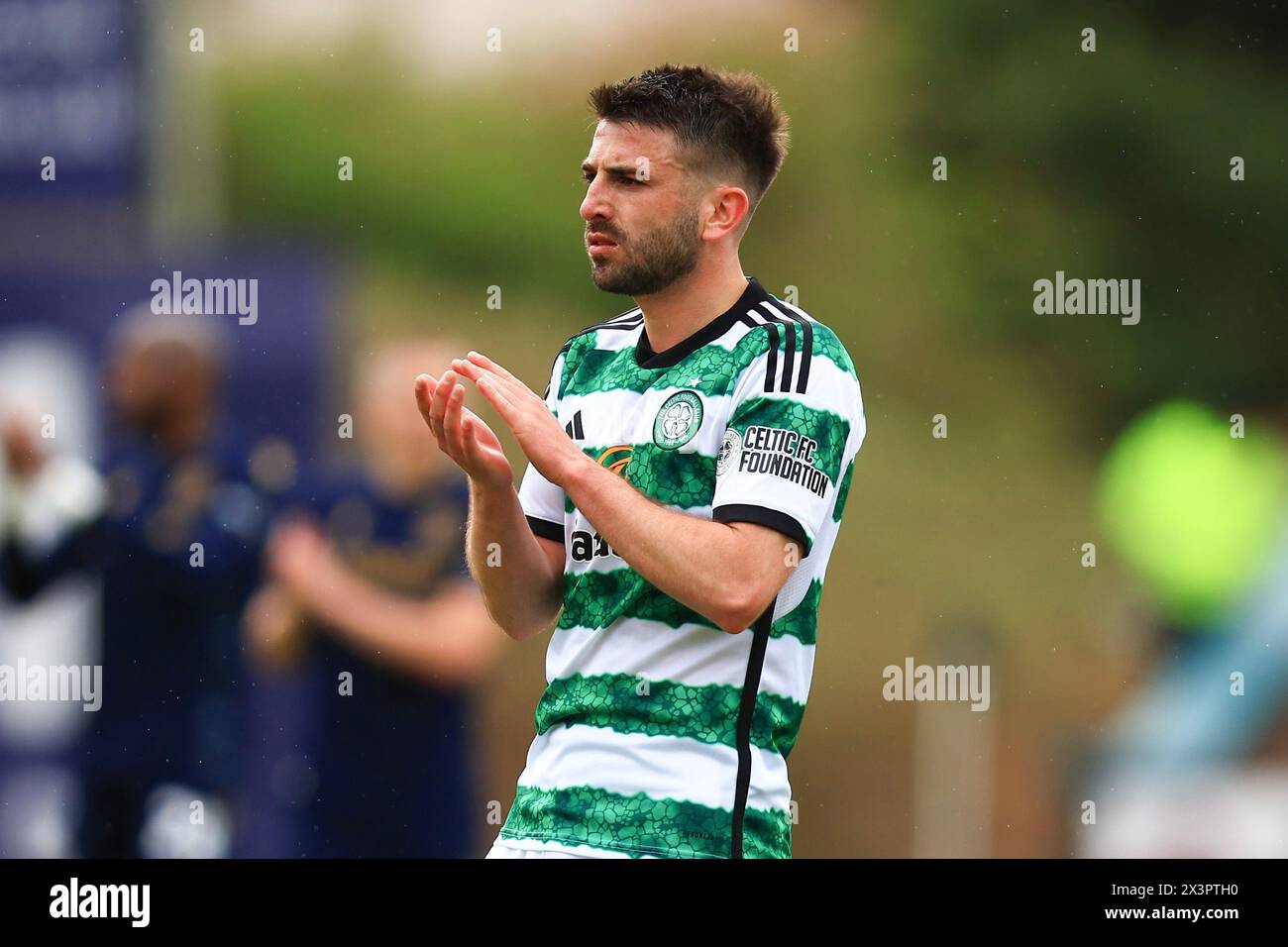Dens Park, Dundee, UK. 28th Apr, 2024. Scottish Premiership Football, Dundee versus Celtic; Greg Taylor of Celtic applauds the fans at the end of the match Credit: Action Plus Sports/Alamy Live News Stock Photo