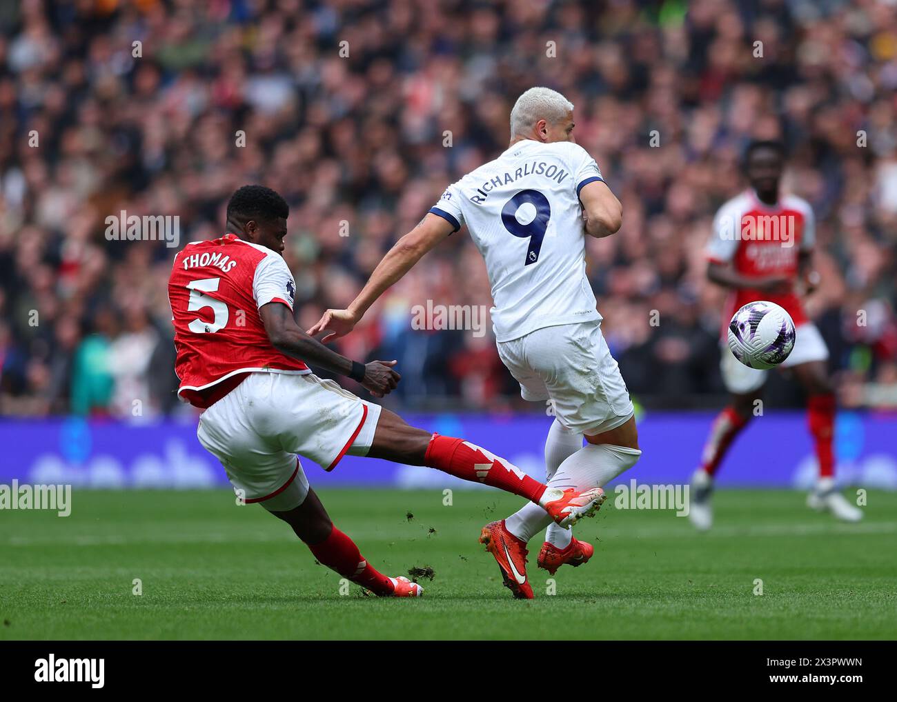 Tottenham Hotspur Stadium, London, UK. 28th Apr, 2024. Premier League Football, Tottenham Hotspur versus Arsenal; Richarlison of Tottenham Hotspur is kicked by Thomas Partey of Arsenal but Referee Michael Oliver refuses to give Spurs a free kick Credit: Action Plus Sports/Alamy Live News Stock Photo