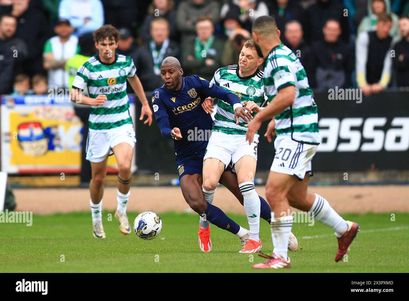 Dens Park, Dundee, UK. 28th Apr, 2024. Scottish Premiership Football, Dundee versus Celtic; Mohamad Sylla of Dundee challenges for the ball with Alistair Johnston of Celtic Credit: Action Plus Sports/Alamy Live News Stock Photo