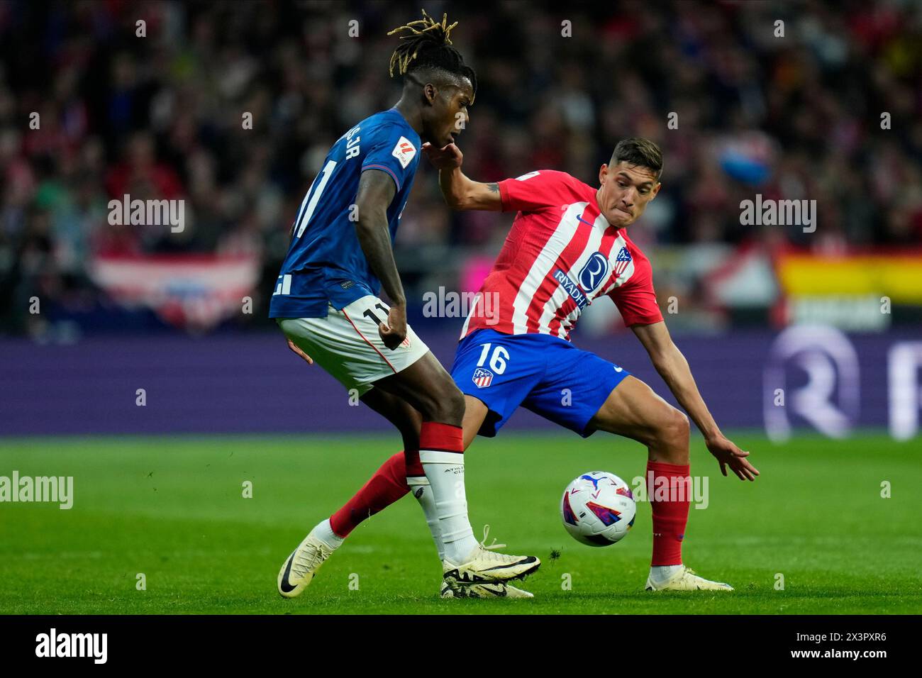 Madrid, Spain. 27th Apr, 2024. Nico Williams of Athletic Club and Nahuel Molina of Atletico de Madrid during the La Liga match between Atletico de Madrid and Athletic Club played at Civitas Metropolitano Stadium on April 27 in Madrid, Spain. (Photo by Cesar Cebolla/PRESSINPHOTO) Credit: PRESSINPHOTO SPORTS AGENCY/Alamy Live News Stock Photo
