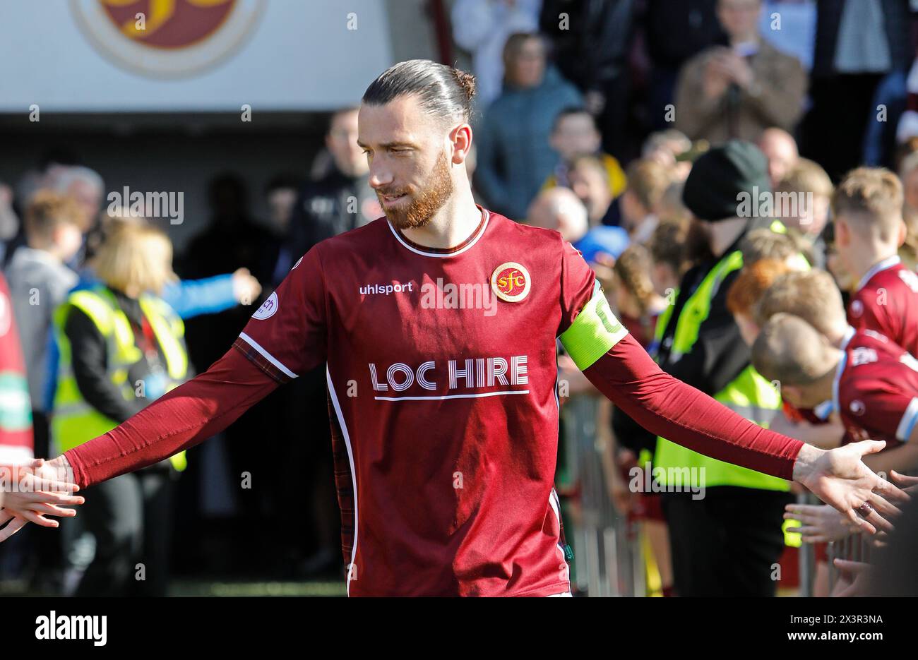 Stenhousemuir FC captain, Gregor Buchanan, heaps the praise of fans as he heads out to lift the Cinch Scottish League Two trophy at Ochilview Park, Stenhousemuir, This is the club's first league title they have won in their 140 year history. Credit: Thomas Gorman/Alamy Live News Stock Photo