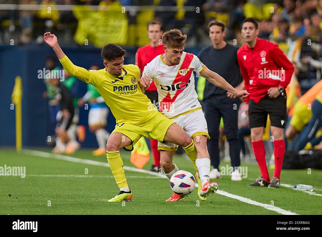 Villarreal, Spain. 28th Apr, 2024. VILLARREAL, SPAIN - APRIL 28: Pep Chavarria Left-Back of Rayo Vallecano competes for the ball with Ilias Akhomach Right Winger of Villarreal CF during the LaLiga EA Spots match between Villarreal CF and Rayo Vallecano at Estadio de la Ceramica, on April 28, 2024 in Villarreal, Spain. (Photo By Jose Torres/Photo Players Images) Credit: Magara Press SL/Alamy Live News Stock Photo