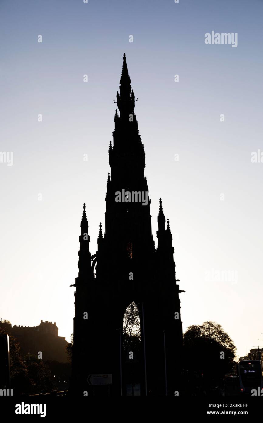 The Scott Monument in Edinburgh, Scotland. Silhouetted by the evening sunlight, the landmark is dedicated to Sir Walter Scott. Stock Photo