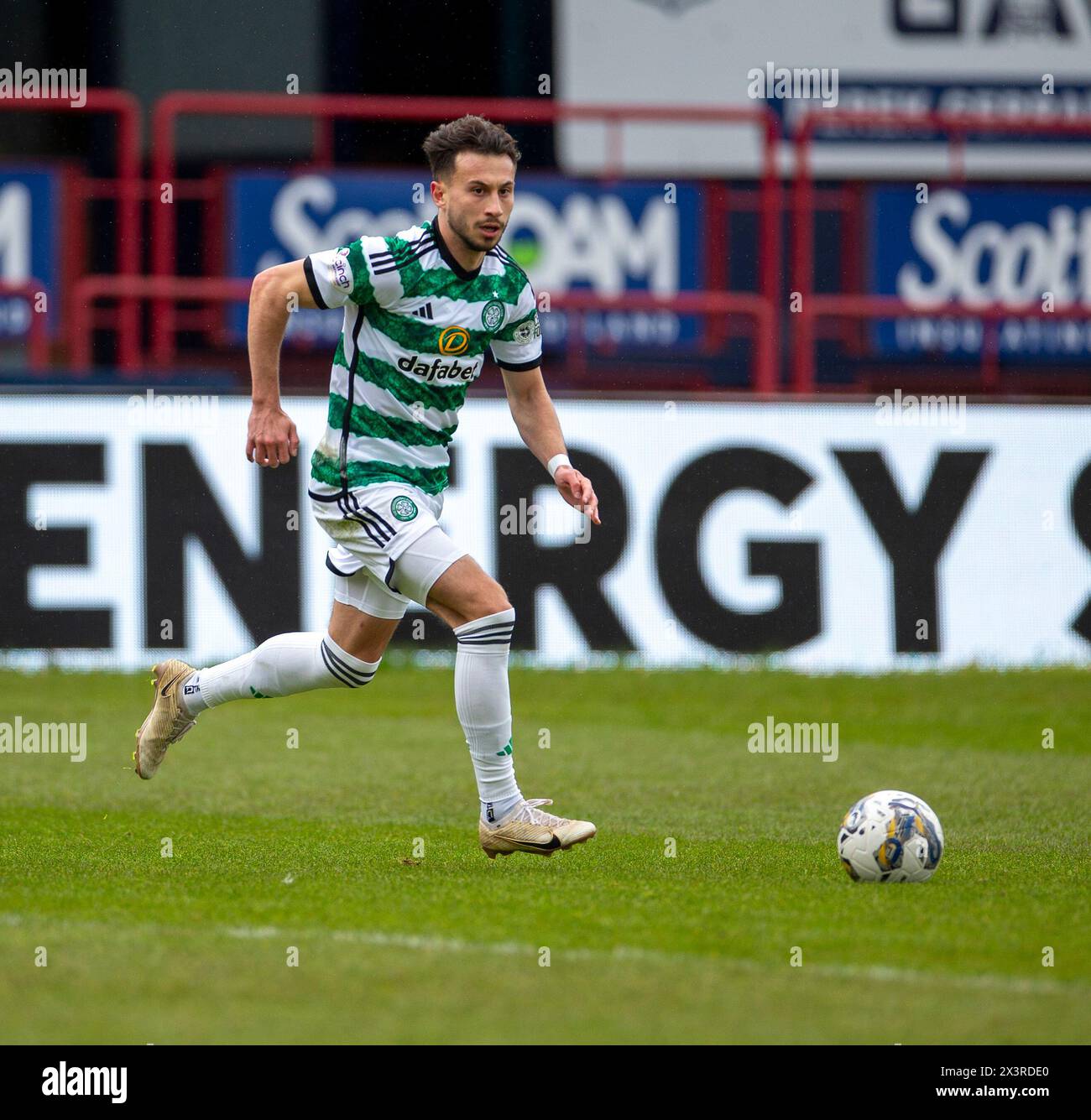 Dens Park, Dundee, UK. 28th Apr, 2024. Scottish Premiership Football, Dundee versus Celtic; Nicolas Kuhn of Celtic on the ball Credit: Action Plus Sports/Alamy Live News Stock Photo