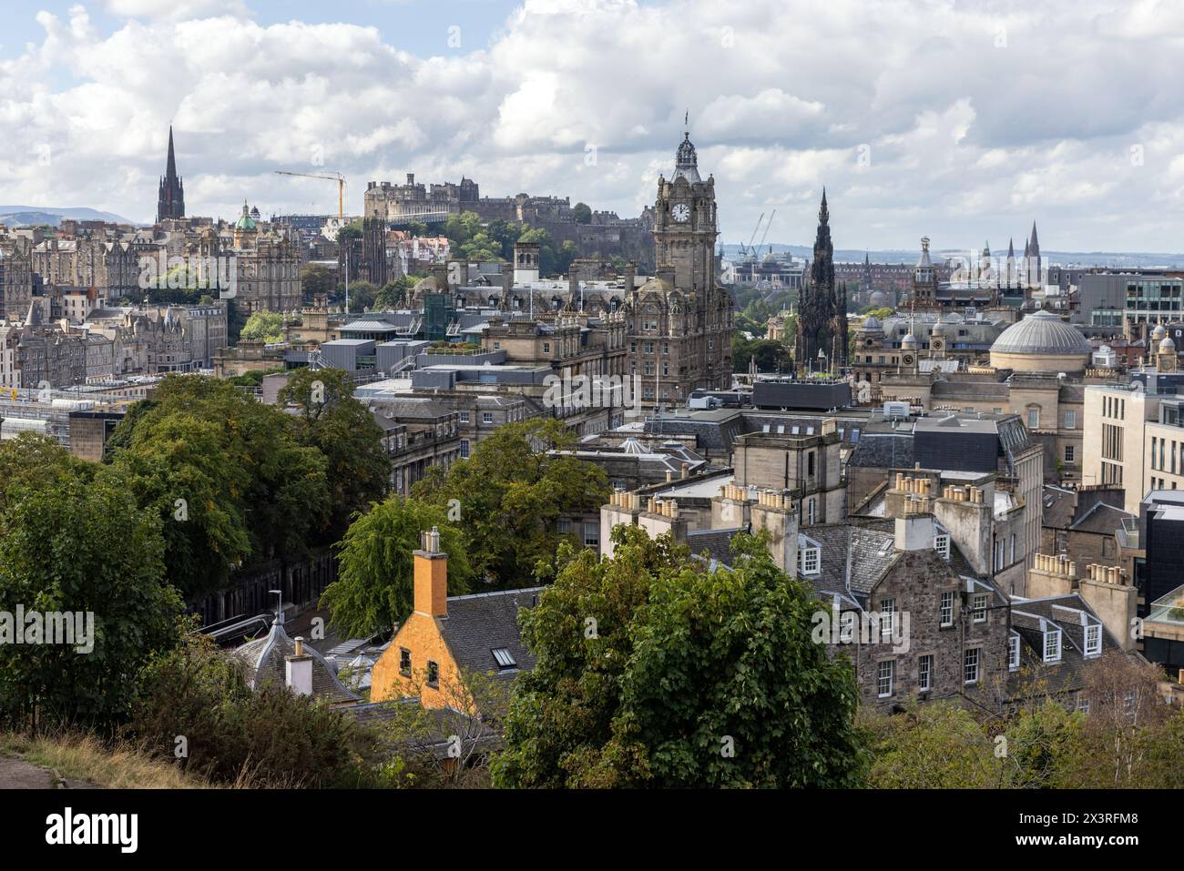 The centre of Edinburgh, with the Balmoral Hotel and Scott Monument prominent on Princes Street, and the castle on the skyline Stock Photo