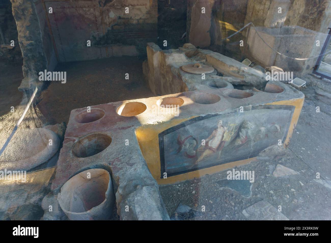 Ancient food counter with ceramic pots at the ancient roman city of Pompeii, Campania, Italy Stock Photo