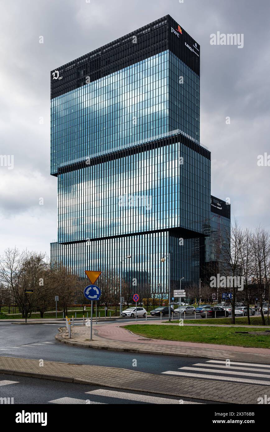 Katowice, Silesian, Poland, March 24, 2024 - Contemporary glass and steel office building of PWC, Panattoni and other service companies Stock Photo