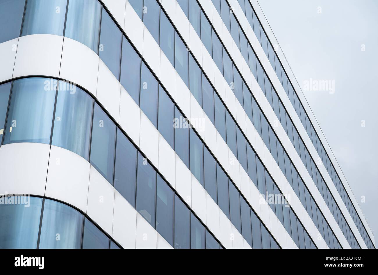 Krakow, Poland, March 25, 2024 - Abstract patterns of a contemporary business office building of the ABB and Tesco technology companies Stock Photo