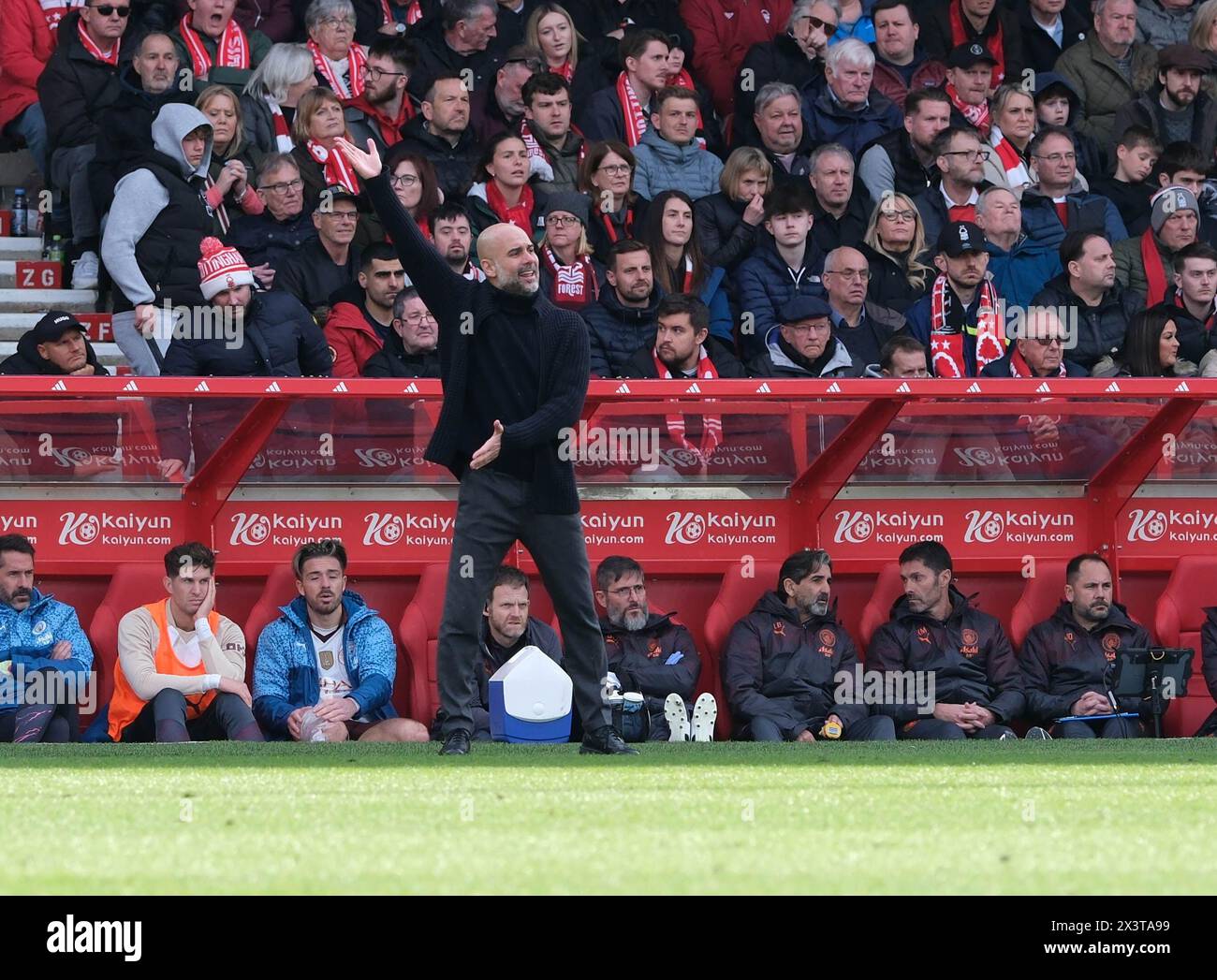 28th April 2024; The City Ground, Nottingham, England; Premier League Football, Nottingham Forest versus Manchester City; Manchester City Head Coach Pep Guardiola shouts instructions to his team Stock Photo